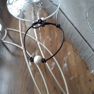 leather bracelet on genuine leather cord, dark bro